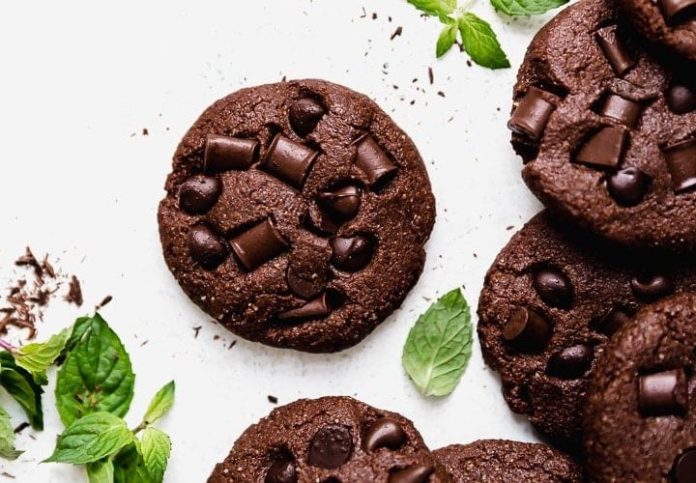 Introduction: For chocoholics and cookie lovers alike, Double Chocolate Nutella Cookies are an irresistible treat that combines the rich flavors of chocolate and the creamy goodness of Nutella. These soft and chewy cookies boast a double dose of chocolate, making them the ultimate indulgence for any sweet craving. This SEO-optimized article will take you on a delightful journey to create these delectable cookies, where the heavenly aroma of chocolate fills the air, leaving you with a smile on your face and a satisfied palate. Summary of the Recipe: Double Chocolate Nutella Cookies are a delightful twist on the classic chocolate chip cookies. The addition of Nutella not only enhances the chocolate flavor but also adds a creamy and luscious texture. These cookies are perfect for sharing with loved ones, serving at parties, or simply enjoying with a glass of milk for a comforting moment. With simple ingredients and easy instructions, these cookies are suitable for both novice and experienced bakers. Now, let's delve into the recipe and explore some frequently asked questions to ensure your Double Chocolate Nutella Cookies turn out to be a mouthwatering success. Recipe: Indulge in Double Chocolate Nutella Cookies Ingredients: 1 cup all-purpose flour ¼ cup unsweetened cocoa powder ½ teaspoon baking powder ¼ teaspoon salt ½ cup unsalted butter, softened ½ cup granulated sugar ½ cup brown sugar, packed ½ cup Nutella spread 1 large egg 1 teaspoon vanilla extract ½ cup chocolate chips (semisweet or milk chocolate) Instructions: Step 1: Preheat the Oven Preheat your oven to 350°F (175°C). Line a baking sheet with parchment paper. Step 2: Mix Dry Ingredients In a medium-sized bowl, whisk together the all-purpose flour, cocoa powder, baking powder, and salt until well combined. Set aside. Step 3: Cream Butter and Sugars In a large mixing bowl, cream together the softened butter, granulated sugar, and brown sugar until light and fluffy. Step 4: Add Nutella, Egg, and Vanilla Mix in the Nutella spread until fully incorporated. Add the egg and vanilla extract, mixing until smooth. Step 5: Combine Wet and Dry Ingredients Gradually add the dry ingredients to the wet ingredients, mixing until just combined. Do not overmix. Step 6: Fold in Chocolate Chips Gently fold in the chocolate chips, distributing them evenly throughout the cookie dough. Step 7: Scoop the Cookie Dough Using a cookie scoop or spoon, portion the cookie dough onto the prepared baking sheet, leaving space between each cookie for spreading. Step 8: Bake the Cookies Bake the cookies in the preheated oven for 10-12 minutes or until the edges are set, but the centers are still slightly soft. Step 9: Cool and Enjoy Remove the cookies from the oven and let them cool on the baking sheet for a few minutes. Then, transfer them to a wire rack to cool completely. Enjoy! 10 FAQs About Double Chocolate Nutella Cookies: Q1: Can I use salted butter instead of unsalted butter? A1: While unsalted butter is recommended for better control of the saltiness, you can use salted butter if that's what you have on hand. Adjust the salt in the recipe accordingly. Q2: Can I use Nutella substitutes like other chocolate spreads? A2: Nutella's unique flavor and creamy consistency are best for these cookies. However, you can use other chocolate spreads if needed. Q3: Can I use whole wheat flour instead of all-purpose flour for a healthier version? A3: Whole wheat flour can be used, but it will result in a slightly denser texture. You can use a mix of whole wheat and all-purpose flour for a compromise. Q4: Can I add chopped nuts to the cookie dough? A4: Absolutely! Chopped nuts like hazelnuts, walnuts, or almonds would be a delicious addition. Q5: How long will the cookies stay fresh? A5: Store the cookies in an airtight container at room temperature for up to five days. Q6: Can I freeze the cookie dough for later use? A6: Yes, you can freeze the cookie dough in a log shape or portioned balls. Thaw the dough before baking. Q7: Can I use dark chocolate chips instead of semisweet or milk chocolate? A7: Dark chocolate chips would complement the Nutella's sweetness wonderfully. Q8: Can I make the cookies smaller or larger? A8: Yes, you can adjust the cookie size to your preference. Just remember to adjust the baking time accordingly. Q9: Can I substitute the egg for a vegan option? A9: Yes, you can use a flax egg (1 tablespoon ground flaxseed mixed with 3 tablespoons water) as a vegan egg substitute. Q10: Can I add a pinch of instant coffee to enhance the chocolate flavor? A10: Absolutely! A pinch of instant coffee will intensify the chocolate taste. Conclusion: Indulge in Double Chocolate Nutella Cookies for a delightful and decadent experience that will delight your taste buds with every bite. These soft and chewy cookies combine the richness of chocolate with the creaminess of Nutella, making them a favorite among chocoholics. Whether you're treating yourself to a sweet moment or sharing them with loved ones, these cookies are sure to leave a lasting impression. The simple recipe and the heavenly aroma of chocolate baking in the oven will make you want to whip up another batch soon. So, get your ingredients ready, preheat the oven, and embark on a journey of indulgence with Double Chocolate Nutella Cookies. Happy baking!